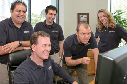 Seated: Lance Merker President/CEO, Left to right: Brian Tusi '07, Shahab Lashkari '09, Drew Clinkenbeard '07, and Jessica Zimmerman '10