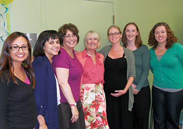 Jane Sweetland (pink shirt) and staff