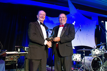 President Richard Rush presents the Robert J. Lagomarsino Award to recipient Steve Blois.