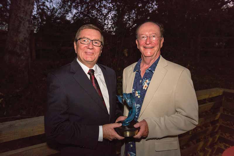 Rabobank President and CEO John Ryan accepts the Lagomarsino Award from President Rush.