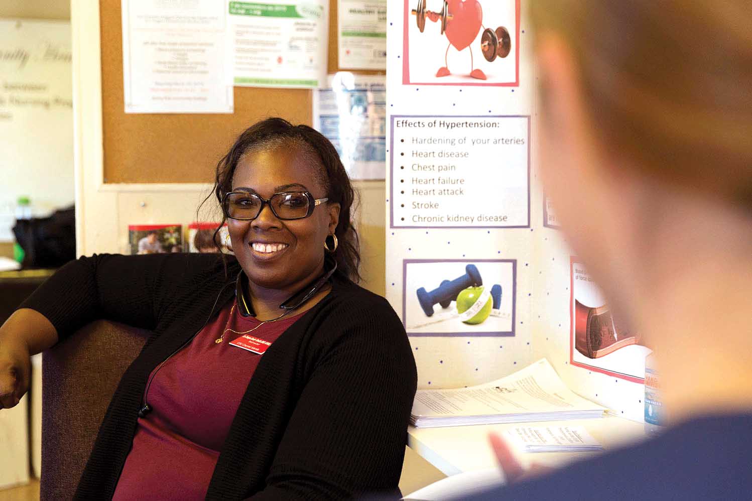 LaSonya Davis listens to a Nursing student.