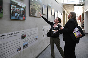 Visitors explore the 10th anniversary exhibit Visitors explore the 10th anniversary exhibit