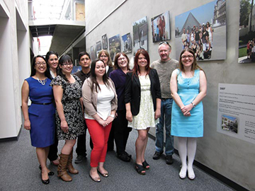 The library’s photo exhibit team: Front row, left to right: Elnora Kelly Tayag, Kaela Casey, Alysha Cordova, Sarah Martinson, Laura Worden; Back row, left to right: Martha Reyes, Marco Ruiz, Barbara Cullin, Evelyn Taylor, Ben Hipple