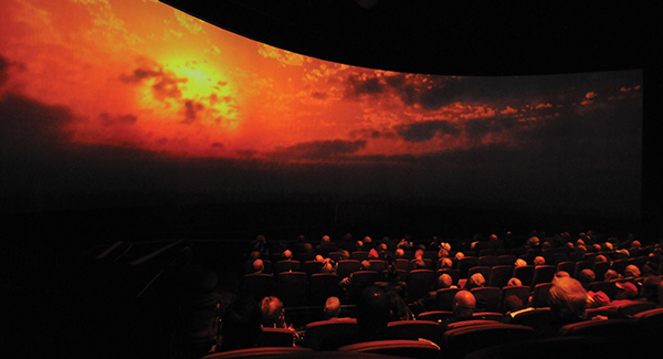 Audience members watch "Beyond All Boundaries" at the National WWII Museum