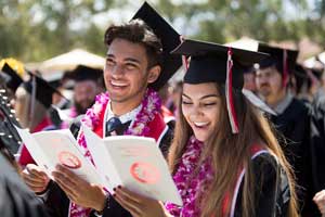 Tassels shifted, CI graduates sing the Alma Mater