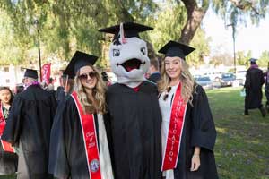 CI mascot Ekho the Dolphin poses with Communication candidates