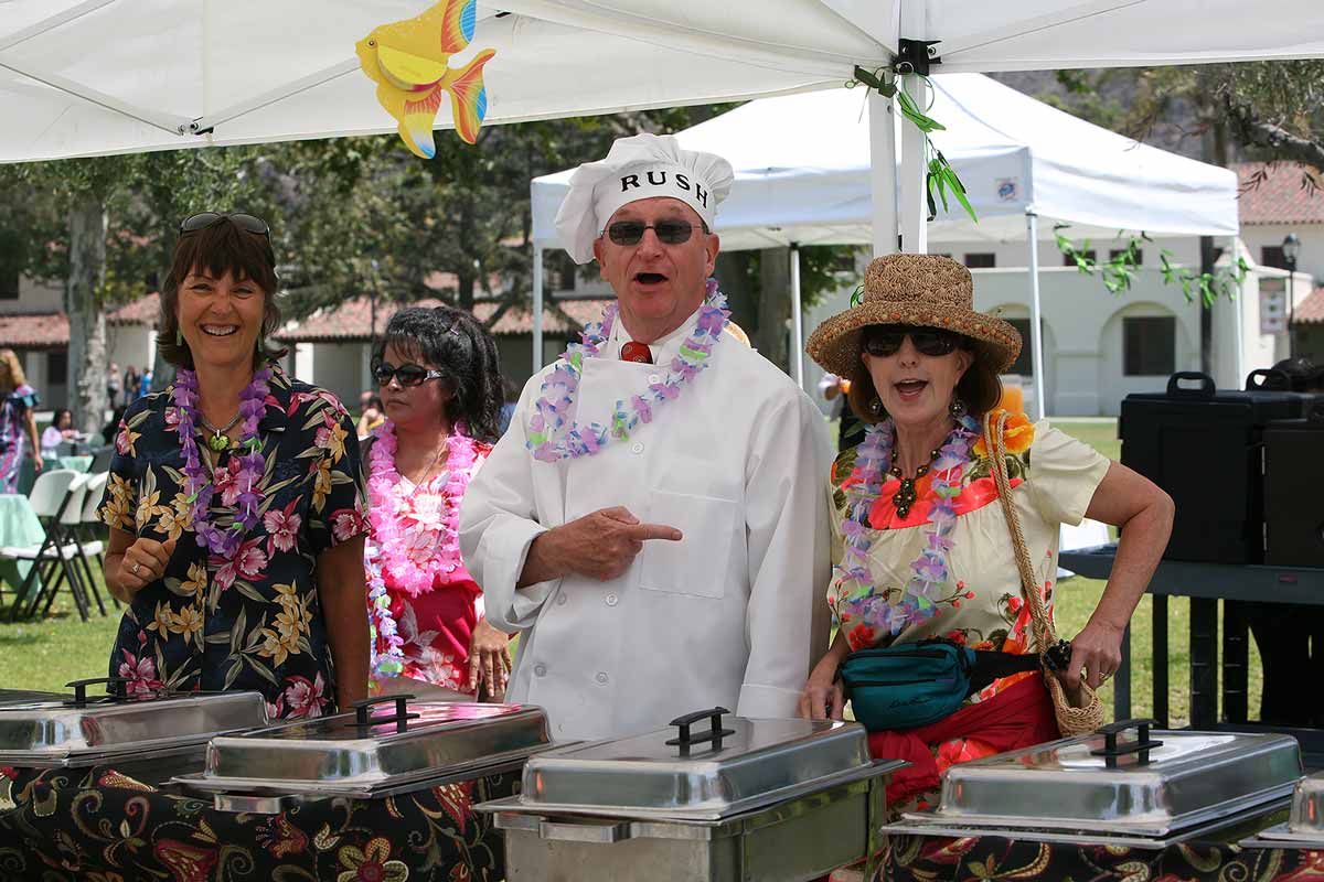 Provost Gayle Hutchinson, President Rush and former Chief of Staff Therese Eyermann serving it up.