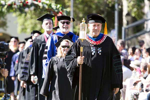 Donald Rodriguez, Program Chair and Professor of ESRM, carries the Light of Learning