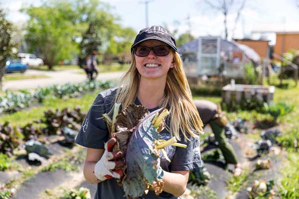 CSUCI student Angie Garelick holding vegetables