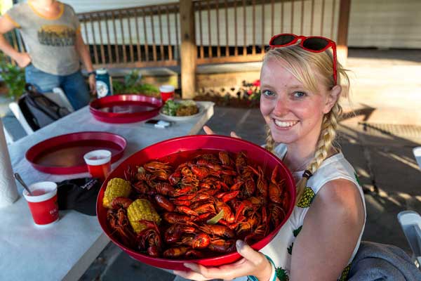 CSUCI student Angie Garelick holding crawdads