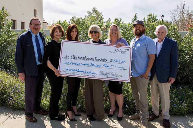 From left to right: Jay Derrico, Kris Postil, Rocky Morton, Elizabeth Grossman, President Erika Beck, student Daniel Cook, ’18 ESRM, and John Notter