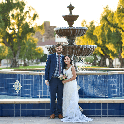 Ryan Stokes and Lauren Gih standing in front of the Central Mall Fountain