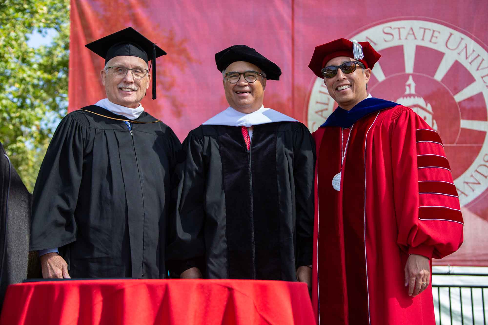 CSU Alumni Trustee Larry Adamson, Peter  Taylor, and President Yao at the May 23 ceremony.