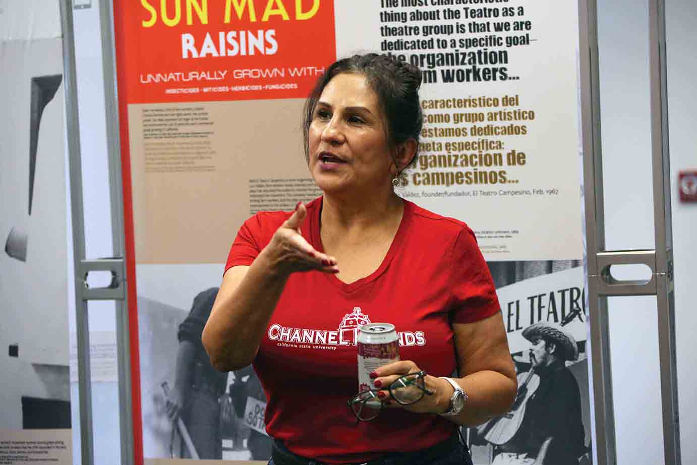 Student Lisa Marie Ruiz speaks during a tour of the exhibit