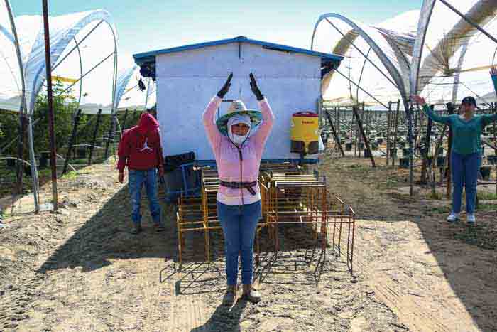 Yolanda Melendez, a ranch crew leader, guides participants through warmup exercises.