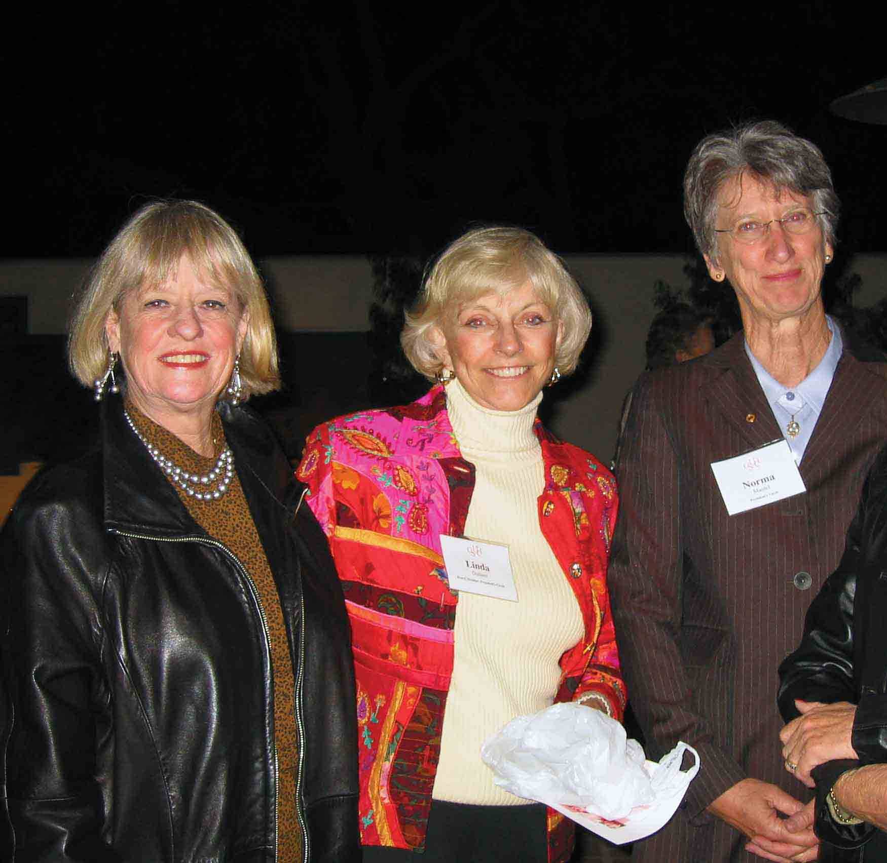 President’s Circle members Patty McMillan, Linda Dullam and Norma Maidel pose at an event in the early 2000s.
