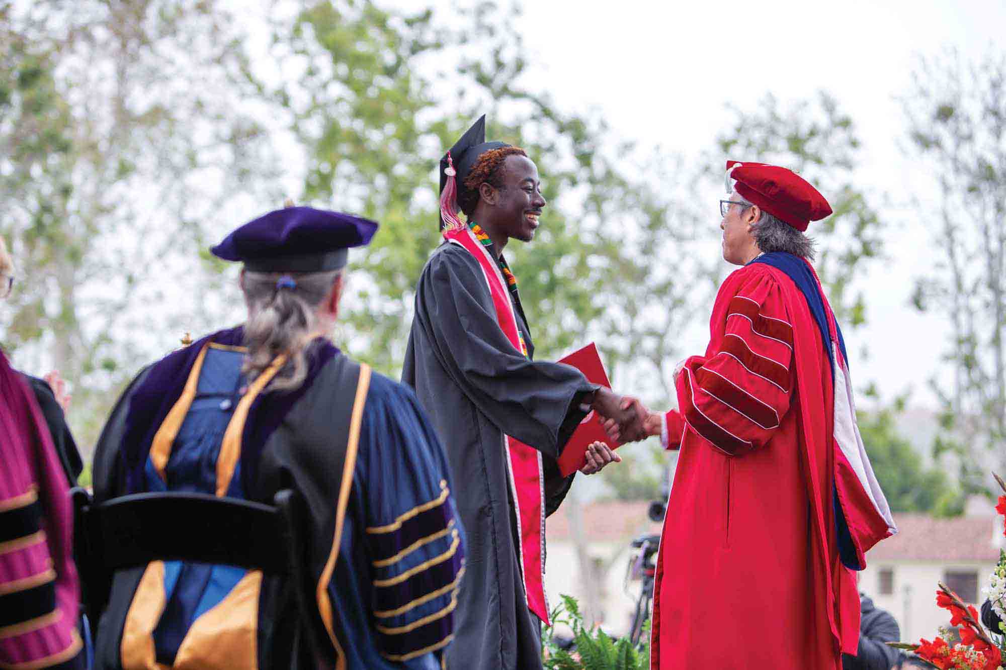 ustin Wiredu-Agyepong receives his diploma from President Yao.