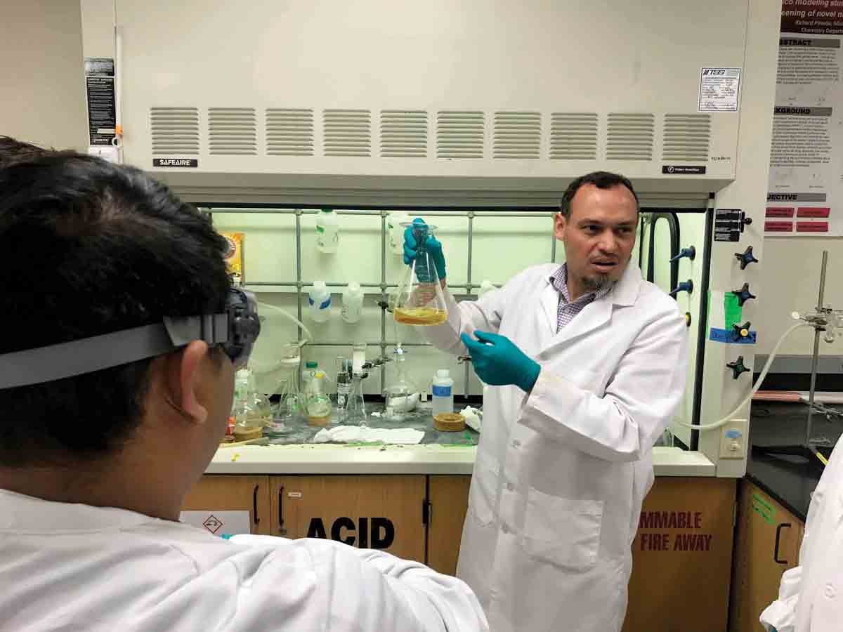 Professor Ahmed Awad teaches a laboratory chemistry class.