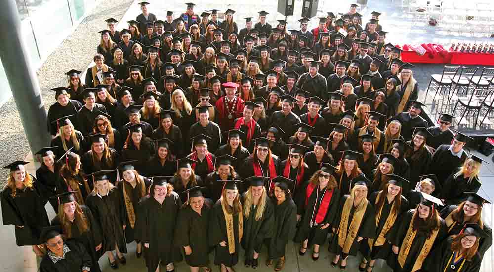 President Richard Rush is surrounded by students at Honors Convocation in 2011.