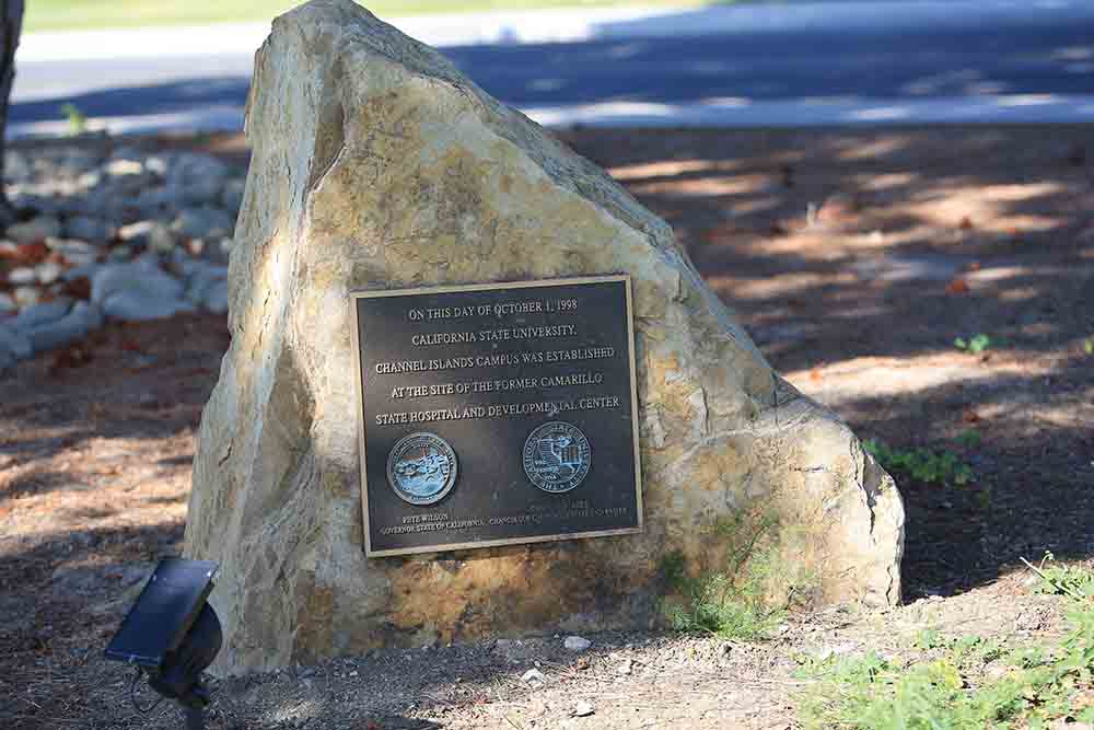 A large rock provided by the Broome family commemorates the Conveyance ceremony in October 1998 transferring the property from Camarillo State Hospital to the California State University.
