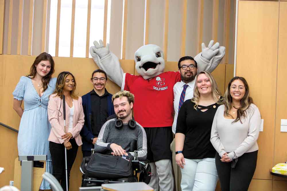 Delta Alpha Pi student members include (left to right): Fiona Pearson, Sarah Ysordia, Ryan Brener, Aidan Wood, Ekho the mascot, Caleb Loera, Bridget Janzen, and Jodi Kautz, DAPi co-advisor and DASS Counselor.