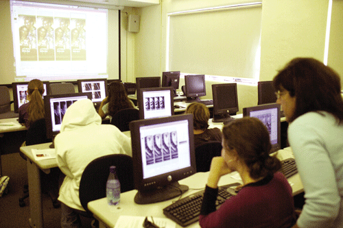 Judy Swanson gives hands on instruction to students