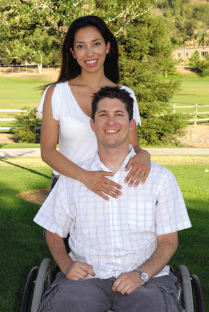 Andrew Skinner posses with his fiancee Kristen Hatchel