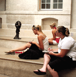 Students sitting and sketching a Picasso sculpture