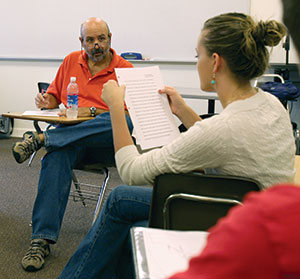 Professor bob mayberry consulting with a student