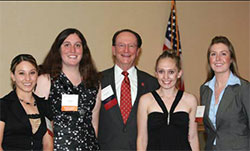 students accept scholarships from president rush