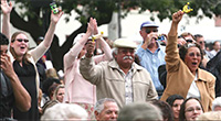 parents and family members cheer on sons and daughters at graduation