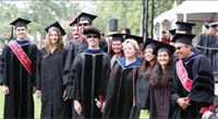 A group of teachers and students pose for award ceremony