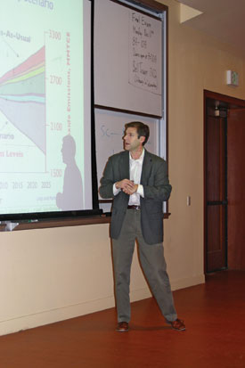 Professor speaking at symposium on environmental issues