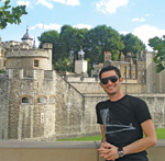 student in front of landmark.