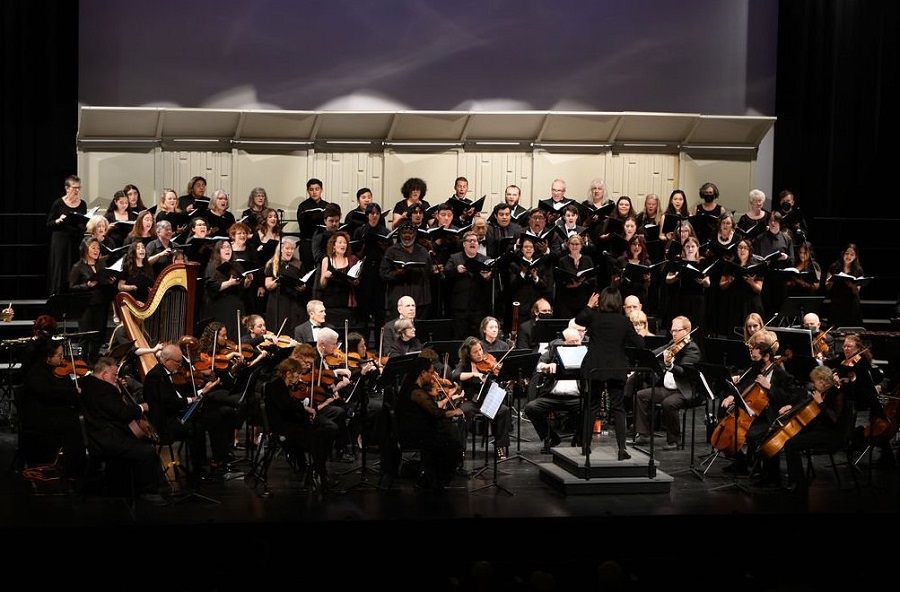The Channel Islands Choral Association performs with the Channel Islands Chamber Orchestra on a large stage
