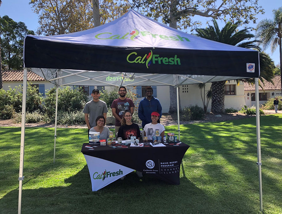 Basic Needs program staff and Cal Fresh reps table on campus at CSUCI