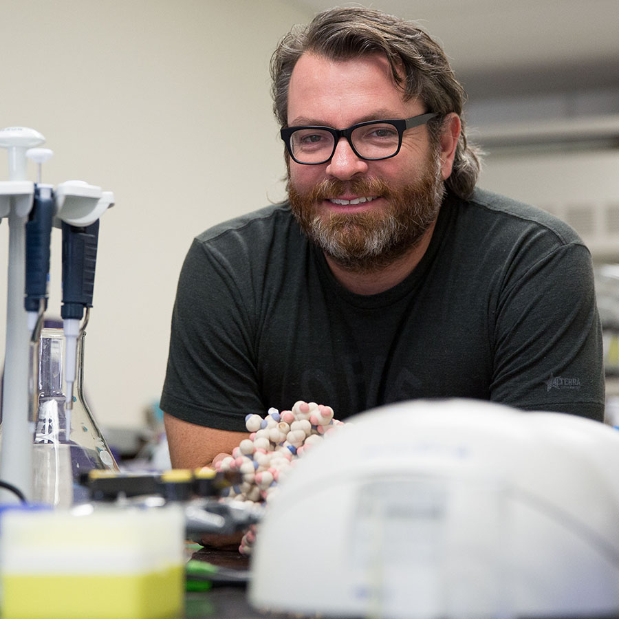 Photo of Blake Gillespie in a Chemistry lab.