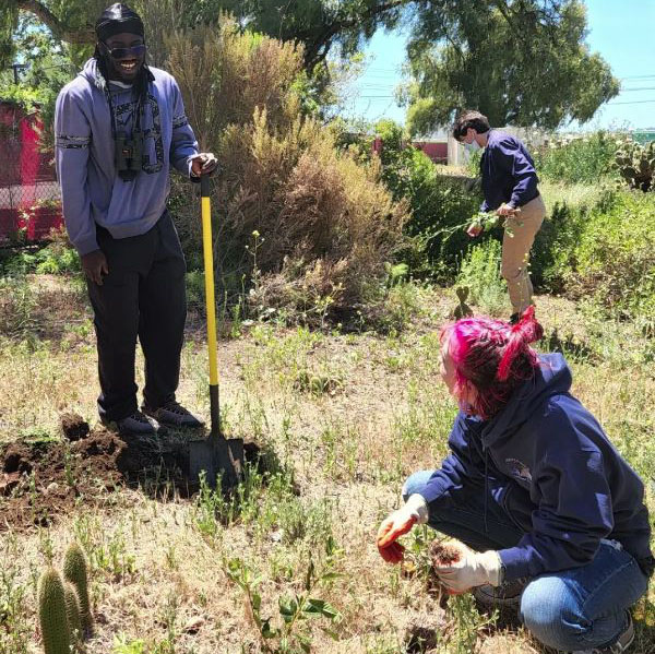 Students participate in planting on Earth Day 2022.