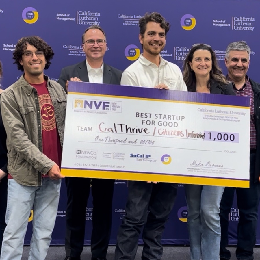 Austin Dent stands with Professor Ballesteros-Sola and others as he receives his award check