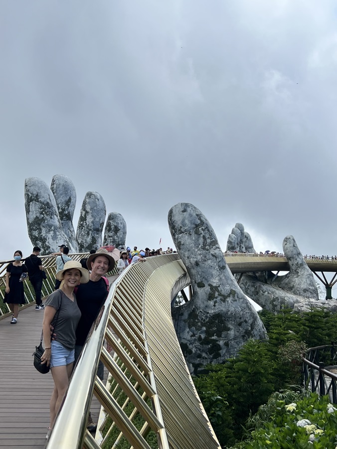 Priscilla Liang poses by a famous landmark in Vietnam