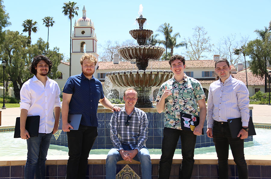 High-Performance Dolphins team who won the HPC competition stands in front of the Central Mall fountain at CSUCI