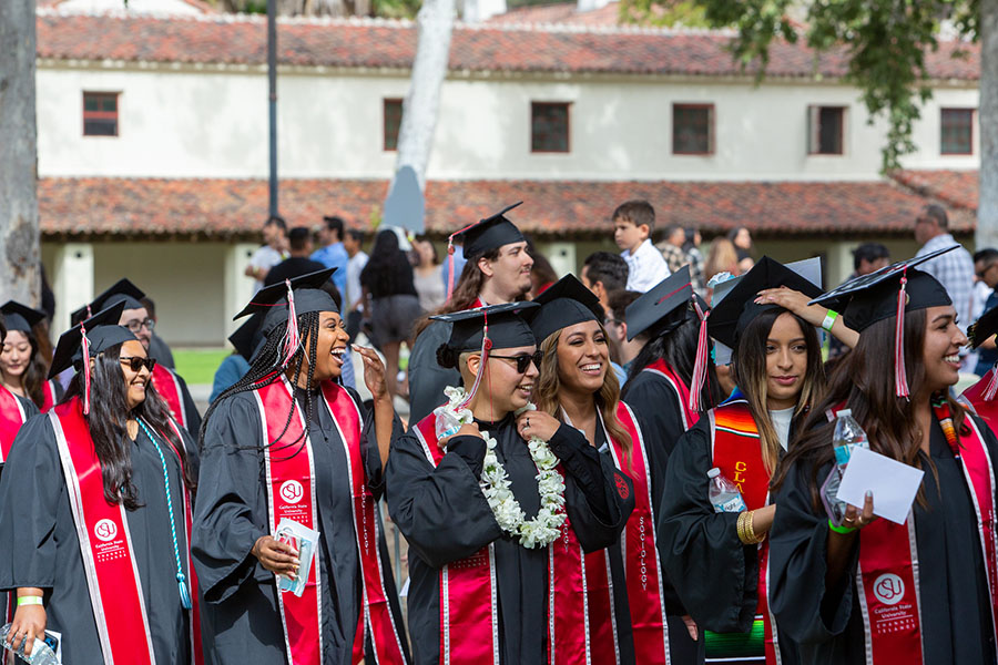 Diverse group of students celebrating at CSUCI Commencement