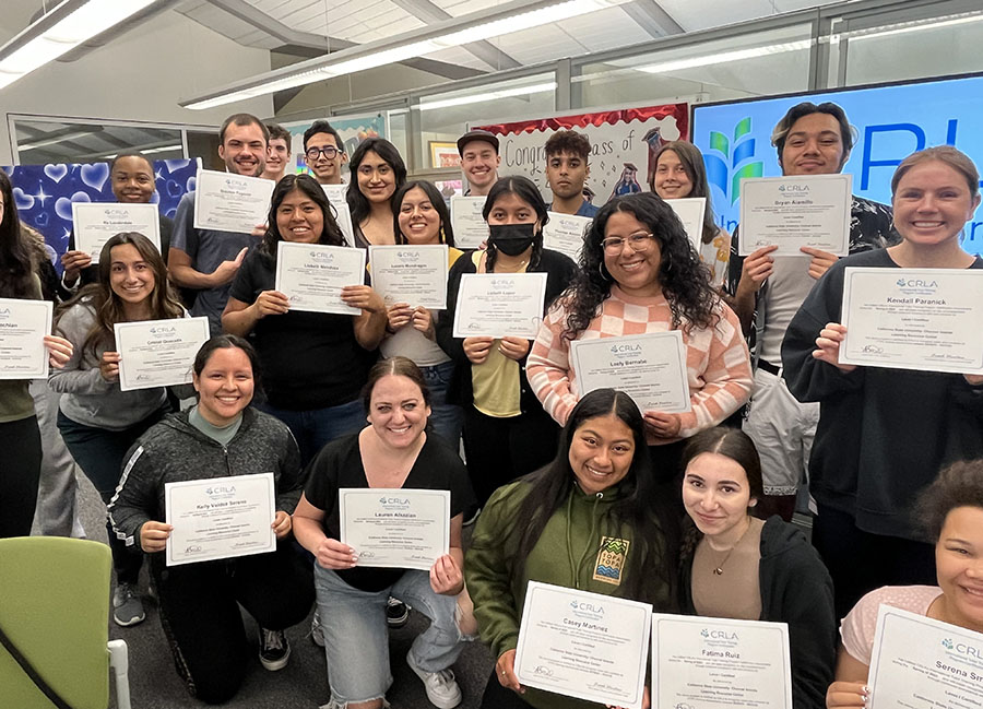 A group of Learning Resource Center tutors pose with their certificates