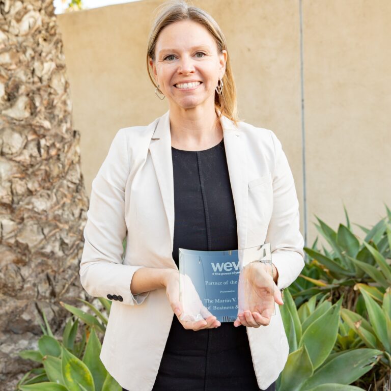 Dean Susan A. Andrzejewski holds the award.