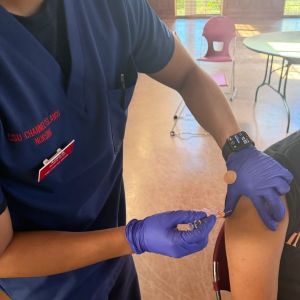 CSUCI Nursing student administering flu vaccine
