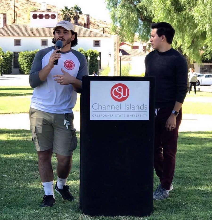 Atticus Reyes and student peer speaking at ASI event during a previous year