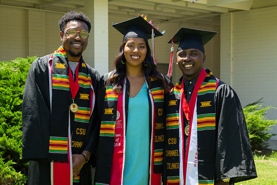 Three African American CSUCI students stand outside together after the Black Student Stoling ceremony