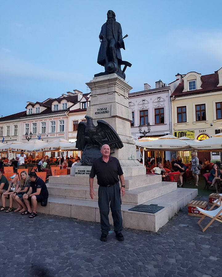 Dr. Baker stands in front of a statue in the Ukrainian capitol of Kiev