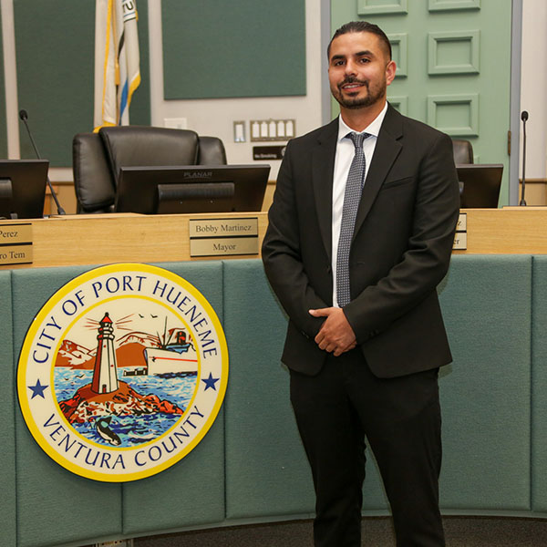 Bobby Martinez stands in front of the City Council Chambers