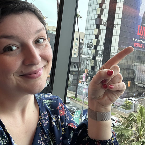 Christina Thiele-Yancy points to a Netflix building sign.